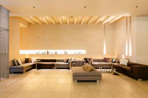 a lobby with couches and a waiting room at Hotel Wing International Premium Shibuya in Tokyo