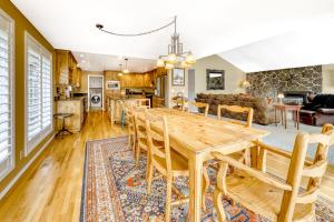 a dining room and living room with a wooden table and chairs at Bend Country Club Golf Course Beauty in Bend