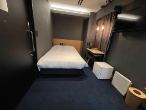Postel nebo postele na pokoji v ubytování Hotel New Shohei