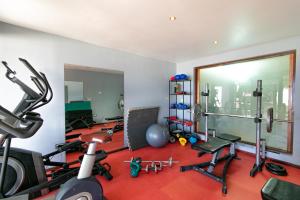 a room with a gym with equipment in it at Reef Beach Resort in General Luna