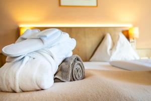Łóżko lub łóżka w pokoju w obiekcie Hotel Das Gastein - ganzjährig inklusive Alpentherme Gastein & Sommersaison inklusive Gasteiner Bergbahnen