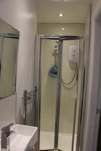 a bathroom with a shower and a sink at The Granby hotel in Whitby