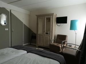 Postel nebo postele na pokoji v ubytování B&B Bovenweg