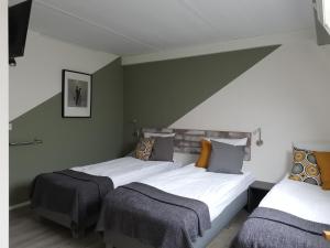 Postel nebo postele na pokoji v ubytování B&B Bovenweg
