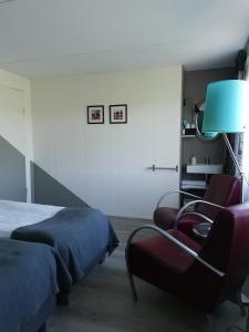 Postel nebo postele na pokoji v ubytování B&B Bovenweg