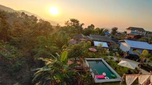 an aerial view of a resort with a swimming pool at บ้านภูคำฟ้า ดอยปู่ไข่ Baan Phu Kham Fah in Chiang Rai