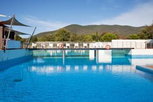 Bazén v ubytovaní Camping Village Rocchette alebo v jeho blízkosti
