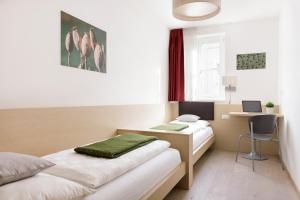 Llit o llits en una habitació de Residence Innichen - San Candido