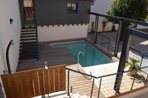 an overhead view of a swimming pool in a house at La Petite Ecole in Marciac