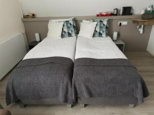 Postel nebo postele na pokoji v ubytování B&B Bovenweg