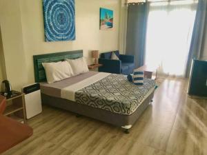 Postel nebo postele na pokoji v ubytování Acapulco Resort