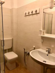 Phòng tắm tại Europa Unita Apartment