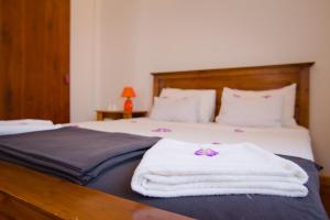 Postel nebo postele na pokoji v ubytování Clove Garden Kandy