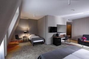 Postel nebo postele na pokoji v ubytování Hotel Sadova