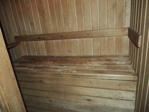 a wooden sauna with a wooden staircase in it at Äksi pastoraadi sviit in Woldi