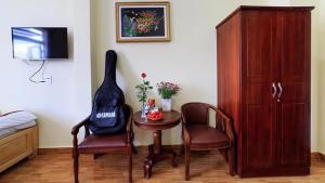 TV a/nebo společenská místnost v ubytování Khách sạn Đoàn Vượng Đà Lạt