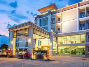 a large building with a sign in front of it at Pangviman Place Resotel SHA Plus in Chiang Mai