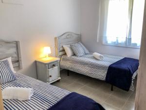 Posteľ alebo postele v izbe v ubytovaní APARTAMENTO VACACIONAL - RELAX