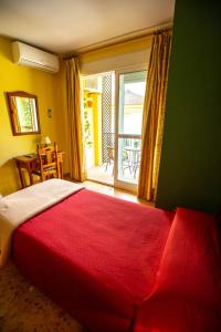 Ein Bett oder Betten in einem Zimmer der Unterkunft Hotel Arunda II