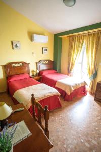 Ein Bett oder Betten in einem Zimmer der Unterkunft Hotel Arunda II