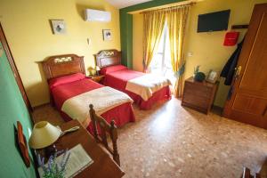 Ein Bett oder Betten in einem Zimmer der Unterkunft Hotel Arunda II