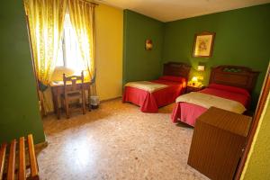 Ein Bett oder Betten in einem Zimmer der Unterkunft Hotel Arunda II