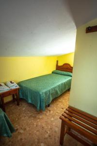 Ein Bett oder Betten in einem Zimmer der Unterkunft Hotel Arunda II