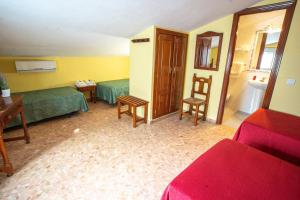 Ein Sitzbereich in der Unterkunft Hotel Arunda II