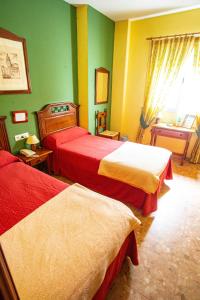 Ein Bett oder Betten in einem Zimmer der Unterkunft Hotel Arunda II