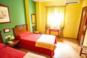 Ein Bett oder Betten in einem Zimmer der Unterkunft Hotel Arunda II