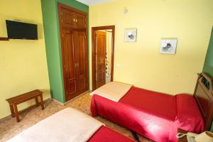 Ein Bett oder Betten in einem Zimmer der Unterkunft Hotel Arunda II
