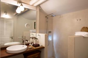 a bathroom with a shower and a sink and a refrigerator at Maison Polanka in Siem Reap