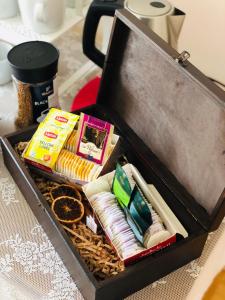 a wooden box filled with different types of snacks at Domowe Zalesie in Piaseczno