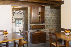 a dining room with wooden tables and chairs at La Hospedería de Salamón in Salamón