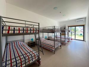 a group of bunk beds in a room at Albergue da Juventude in Tancos