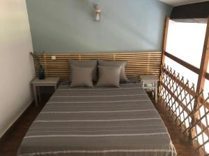 Кровать или кровати в номере Le Relais de Sisco