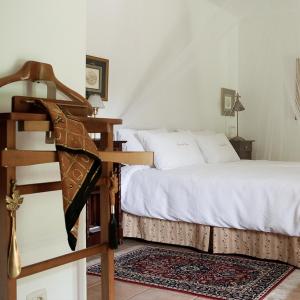 Giường trong phòng chung tại Casa do Ouro