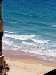 a view of a beach with the ocean at APARTAMENTO CORTADURA BEACH in Cádiz