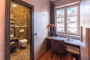 a bathroom with a desk and a shower at Seven Stories Rooms, 4th Floor, no elevator in Zagreb +47 photos
