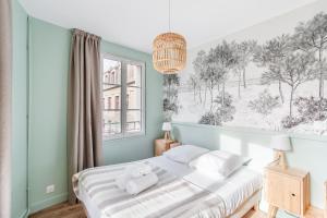 Postel nebo postele na pokoji v ubytování Le Cap Cézembre - Intra-Muros Saint-Malo + 4 fotografie