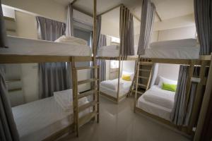 Postel nebo postele na pokoji v ubytování 漫時光 旅空間 ManLu INN
