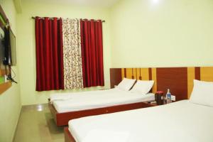 Hotel Shree Hari客房内的一张或多张床位