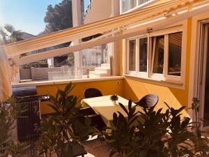 a patio with a table and chairs on a balcony at Apartment Gio in Novigrad Istria +7 photos