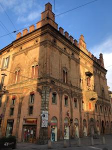 an old brick building on a city street at B&B Il Viaggio Bologna in Bologna