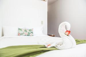 Cama o camas de una habitación en The Palms At Coco Beach