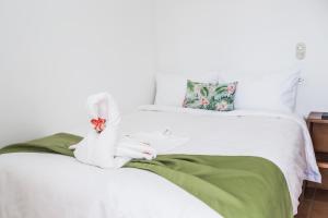 Cama o camas de una habitación en The Palms At Coco Beach