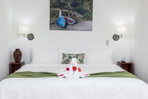 Cama o camas de una habitación en The Palms At Coco Beach
