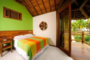 Cama ou camas em um quarto em Marauba Beach House - Taipu de Fora