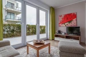 TV a/nebo společenská místnost v ubytování Villa Bernstein