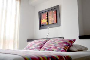 Postel nebo postele na pokoji v ubytování Hotel Mare Apartasuite